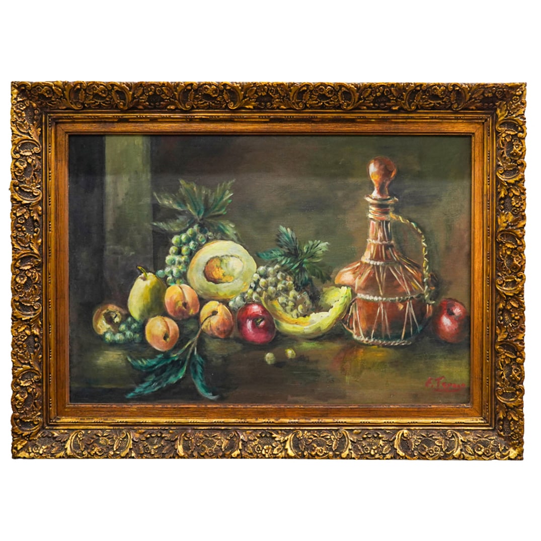Signed Still Life Oil On Canvas: DESCRIPTION: Oil on canvas painting depicting a still life of fruit on a table next to a wine bottle. Signed illegibly at lower right. Mounted in a gilt wood frame. CIRCA: 20th Century ORIGIN: Contine