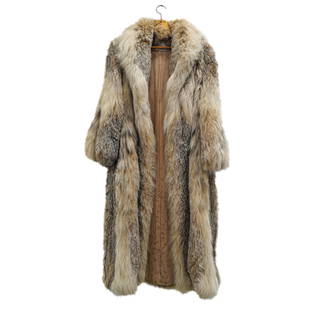 Vintage Gustin Fur Sable Full Length Coat: DESCRIPTION: Vintage full length sable coat retailed by Gustin Fur New York and featuring a light brown hue with hints to black and white. Interior lining is silk and bears a monogram. CIRCA: