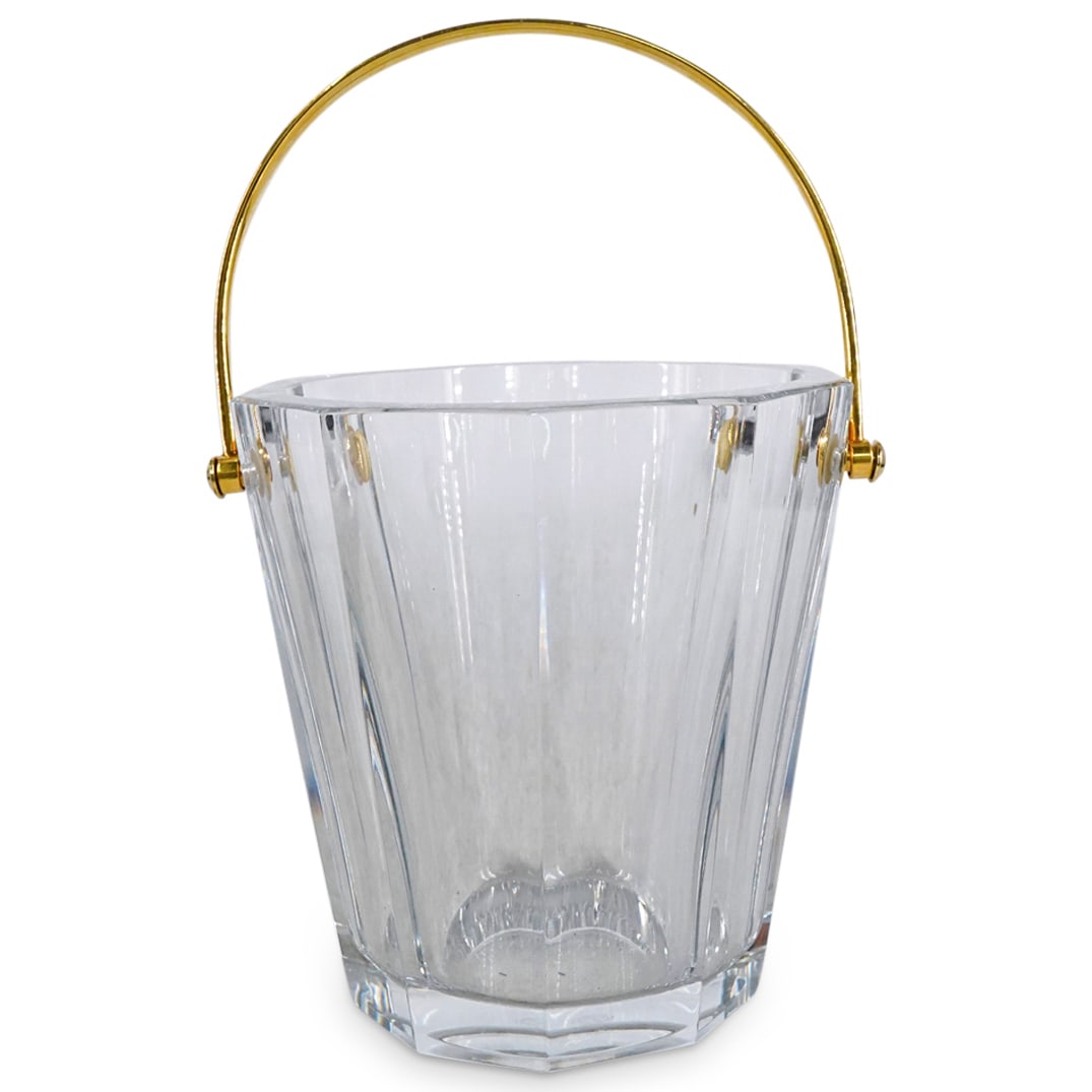 Baccarat Crystal Ice Bucket W/ Gold Plated Handle: DESCRIPTION: Baccarat crystal ice bucket featuring gold-plated handle. Marked with "Baccarat France" on underside. Handle stamped with "Baccarat" twice. CIRCA: 20th Century ORIGIN: French DIMENSIONS: 