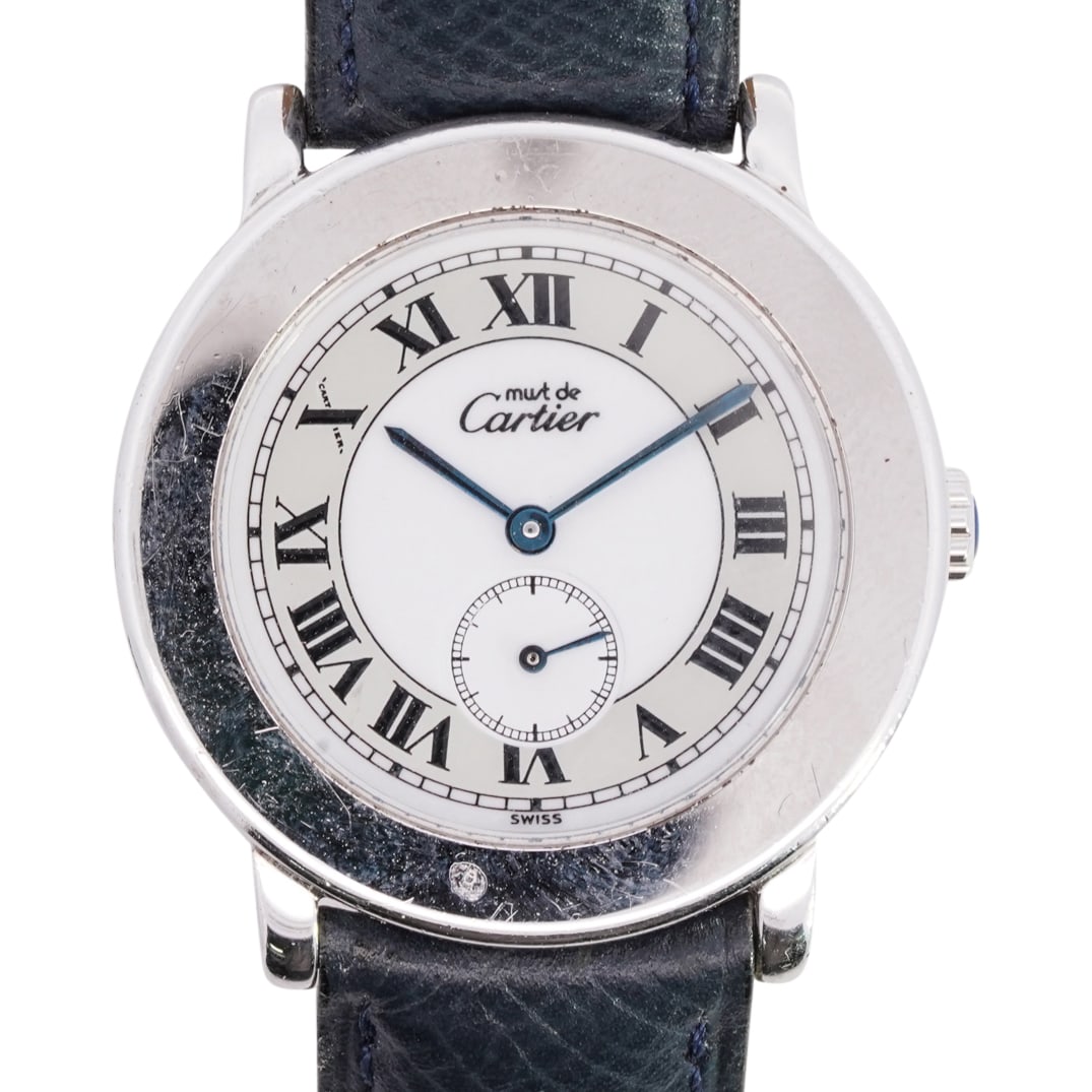Cartier Must De Stainless Steel Watch: DESCRIPTION: Cartier Must De Stainless Steel Watch REF#1815 featuring a quartz movement, white dial, sub dial, black roman numerals, sapphire hands. flanked on the side with a sapphire cabochon. attac
