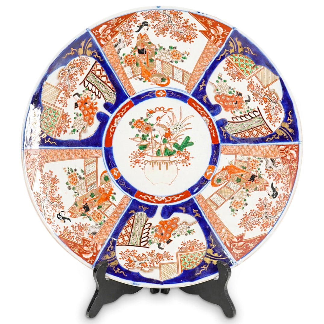 Vintage Japanese Imari Porcelain Charger: DESCRIPTION: A Vintage Japanese Imari porcelain charger decorated with classic cobalt blue and rusted red hues along the bordering, centered by floral bouquet motif. CIRCA: Earl-Mid 20th Cent. ORIGIN: