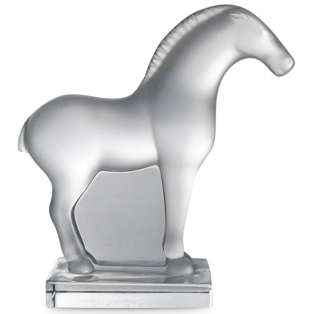 Lalique Crystal "Tang Horse" Figure: DESCRIPTION: Lalique frosted and clear crystal "Tang Horse" figurine. Marked at side of base. CIRCA: Late 20th - Early 21st Century ORIGIN: French DIMENSIONS: H: 3.5" W: 1" L: 3.5" CONDITION: Great co