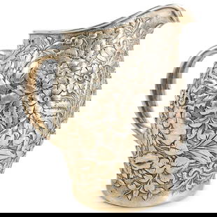 Antique Whiting Manufacturing Company Sterling Silver Pitcher: DESCRIPTION: Antique sterling silver pitcher by Whiting Manufacturing Company featuring repousse floral and foliage designs throughout the body. Hallmarked on underside and numbered "2200A". Total wei