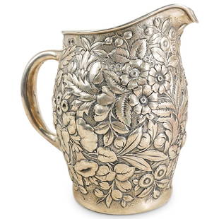 Antique Whiting Manufacturing Company Sterling Silver Pitcher: DESCRIPTION: Antique sterling silver pitcher by Whiting Manufacturing Company featuring repousse floral and foliage designs throughout the body. Hallmarked on underside and numbered "2200A". Total wei