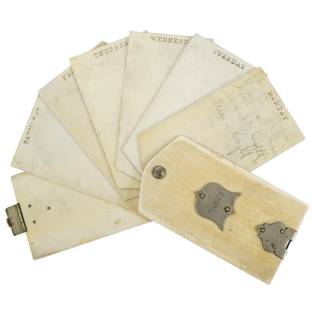 19th Cent. Carved Bone and Silver Plated Day Planner: DESCRIPTION: a 19th cent. carved bone planner features (6) slides Headed by Monday-Saturday, mounted by a silver plated hinged closure and a monogrammed plaque reading "E. Heal". Similar to the one us