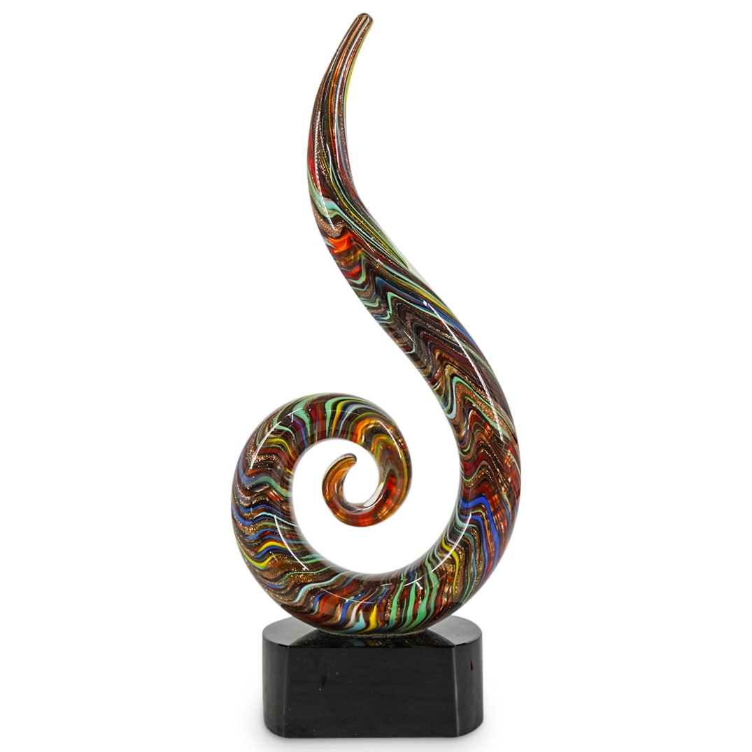 Murano Glass Aventurescent Abstract Swirl: DESCRIPTION: Murano glass sculpture depicting an abstract swirl crafted in various tones with aventurescent, goldstone accents. Mounted on a black glass base. CIRCA: 20th Century ORIGIN: Italy DIMENSI