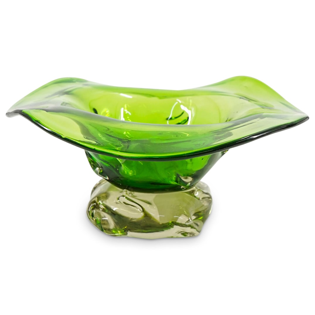 Murano Art Glass Footed Centerpiece Bowl: DESCRIPTION: Murano art glass footed centerpiece bowl designed with a clear base, and a wide translucent green body with open rim. CIRCA: 20th Century ORIGIN: Italy DIMENSIONS: H: 5" W: 10 1/2" CONDIT