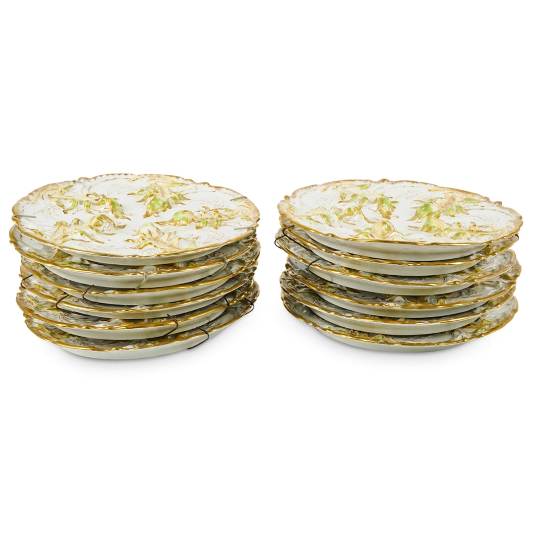 (12 Pc) Theodore Haviland Porcelain Plates: DESCRIPTION: 12 Theodore Haviland polychrome porcelain plates each featuring raised foliage motifs and gilt accents and each marked on underside. CIRCA: Early - Mid 20th Century ORIGIN: French DIMENSI