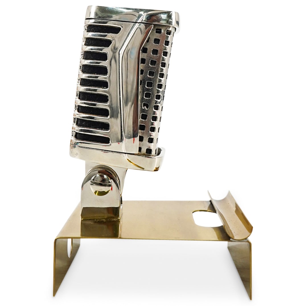 Microphone Desk Decor Pen Holder Tray: DESCRIPTION: Microphone-shaped desk decorative pen holder tray. Depicts a hinged microphone with nickel finish on a brass tray with a pen holder compartment. CIRCA: 20th Century ORIGIN: Continental DI