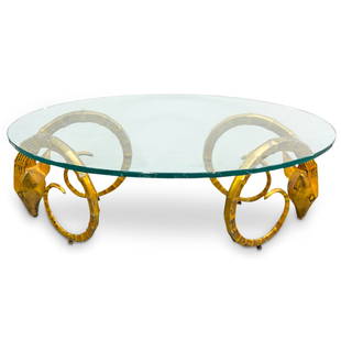 Alain Chervet Style Bronze Ibex Head Coffee Table: DESCRIPTION: Modernist coffee table in the style of Alain Chervet composed of two bronze sculptures of ibex heads with long, curling horns supporting a glass top. CIRCA: 20th Century ORIGIN: European