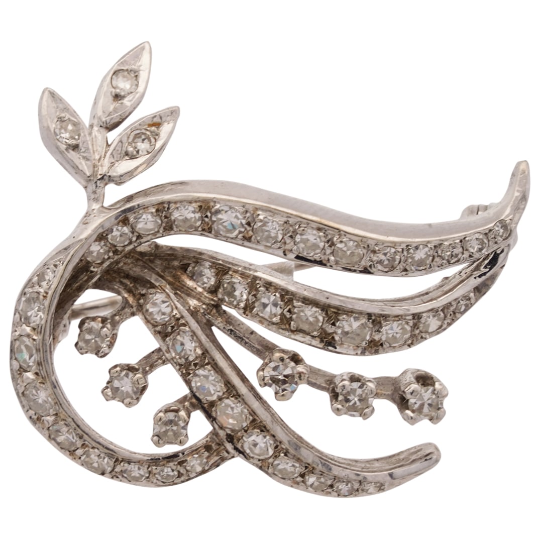Art Deco 14k Gold and Diamond Brooch: DESCRIPTION: An Art Deco 14k white gold brooch features in a leaf vine form, inset with a series of diamonds amounting to approx. 1.75cts total. unmarked, Total Weight: 4 6 Grams (2.9 dwt) CIRCA: 1920