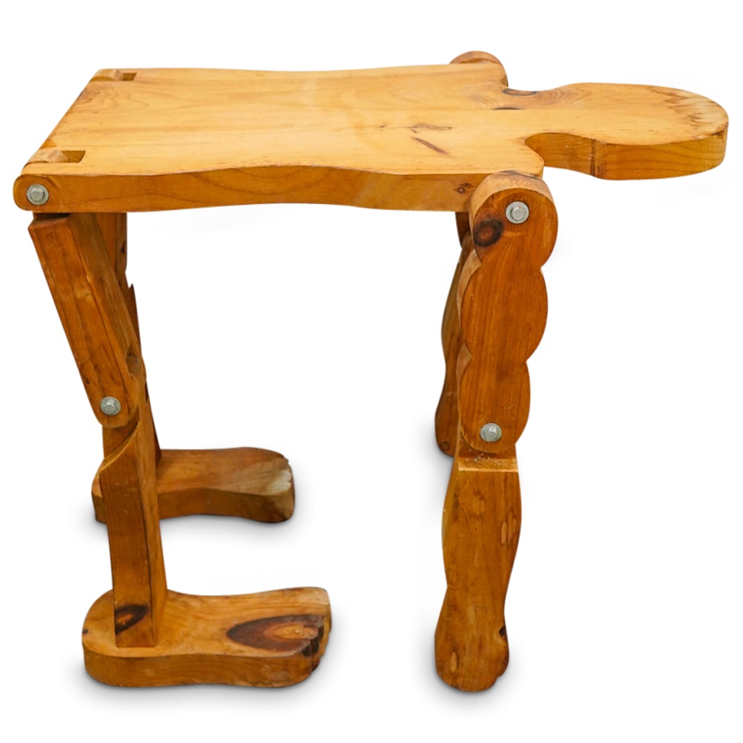 Humanoid Wooden Table: DESCRIPTION: Unusual figural wooden table featuring movable joints. CIRCA: Late 20th - Early 21st Century ORIGIN: Unknown DIMENSIONS: H: 23.75" W: 19" L: 29.75" CONDITION: Elbow joints and proper righ