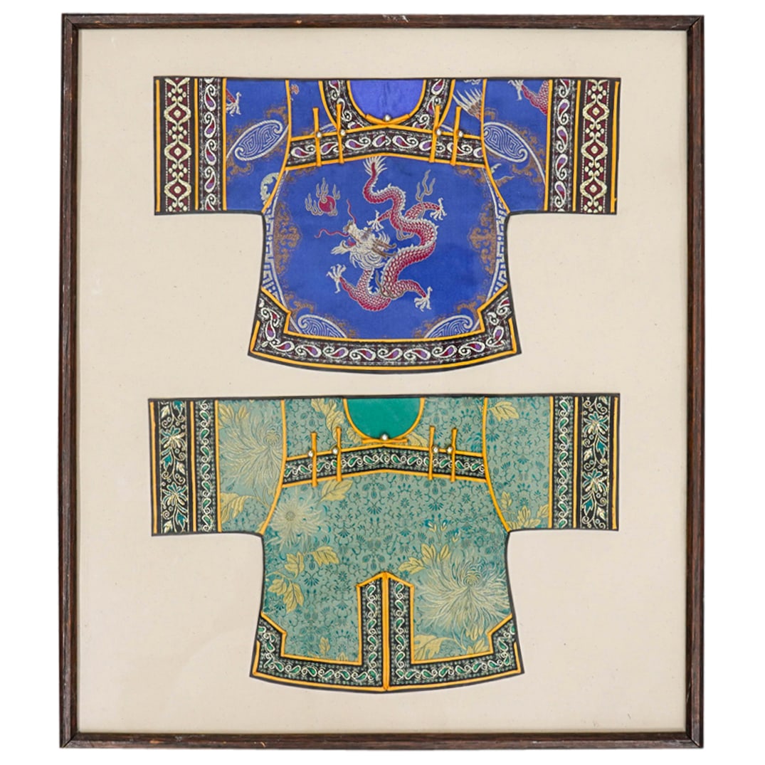 Pair Of Vintage Chinese Miniature Silk Shirts: DESCRIPTION: Vintage miniature silk shirts mounted in a wooden frame: one green with gilt accenting and floral and foliage designs, one blue with a dragon motif and paisley patterns. CIRCA: 20th Centu
