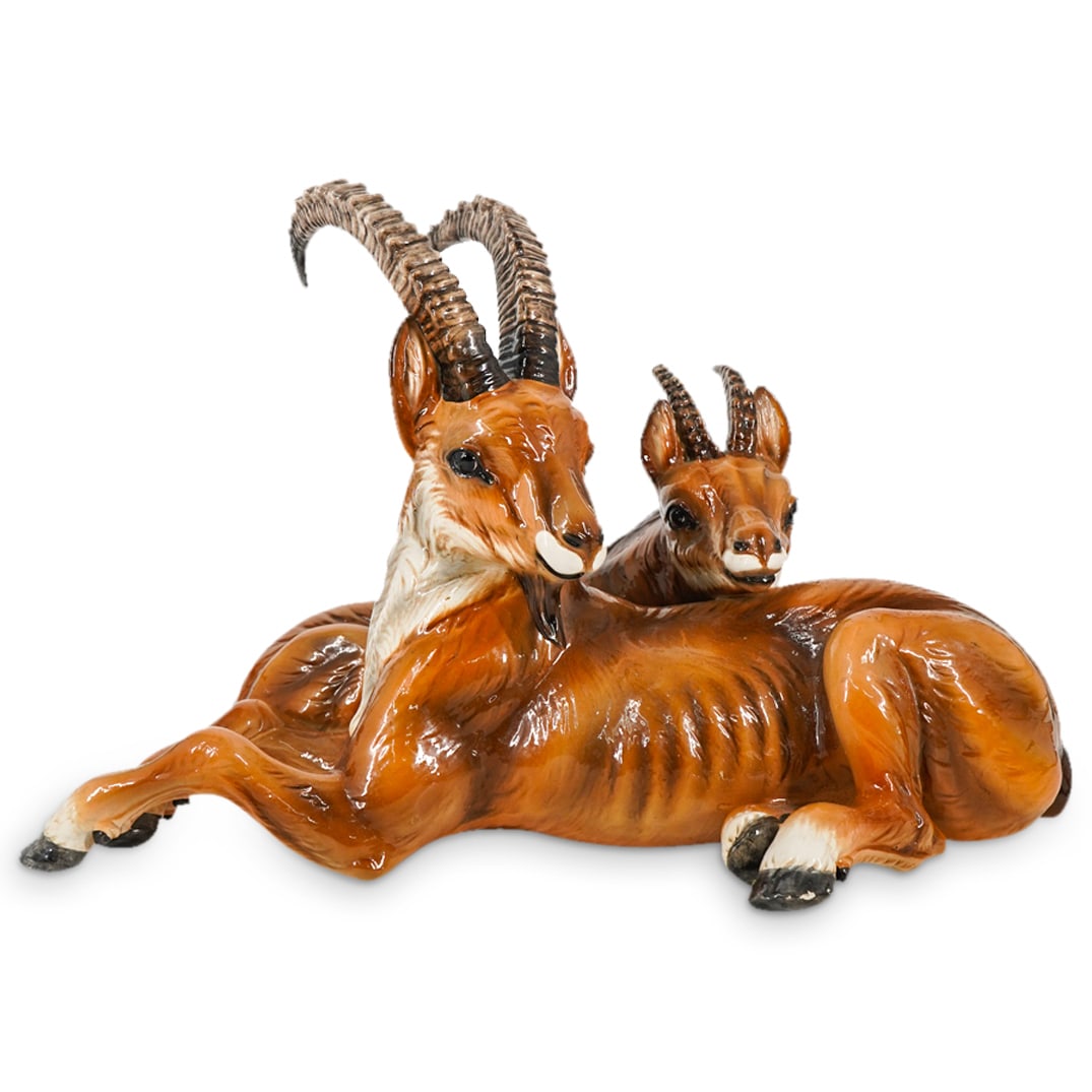 Vintage Ronzan Porcelain Majolica Antelopes: DESCRIPTION: Majolica porcelain sculpture depicting two recumbent antelopes - one male, one female - leaning on each other. Signed "Ronzan" on underside for an illegible company. CIRCA: 20th Century O