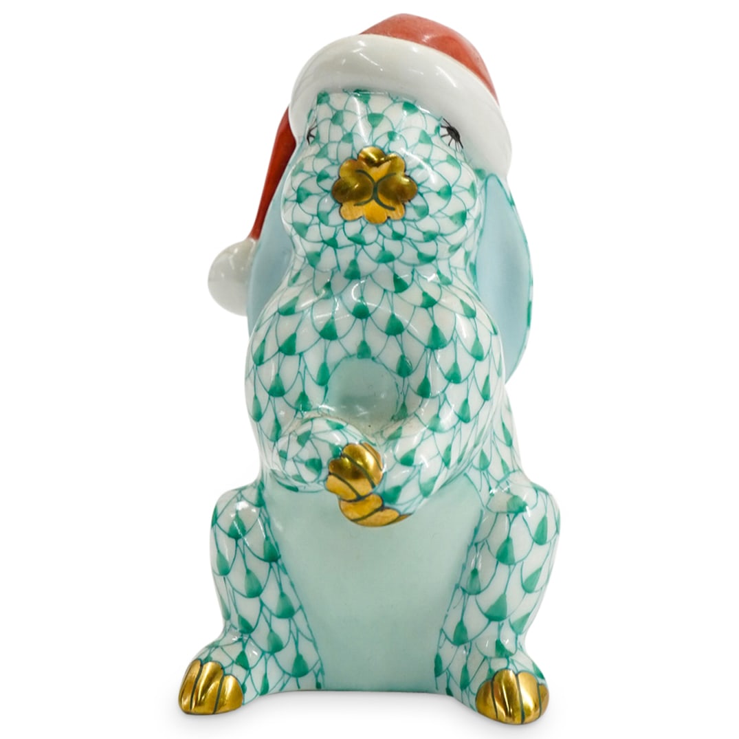 Herend Porcelain "Santa Bunny" Green Fishnet Figurine: DESCRIPTION: Herend porcelain figurine of a "Santa Bunny" embellished in a green hued fishnet pattern. Finished with gilded accents. Style: #5702. Marked along the underside with Herend stamps. CIRCA: