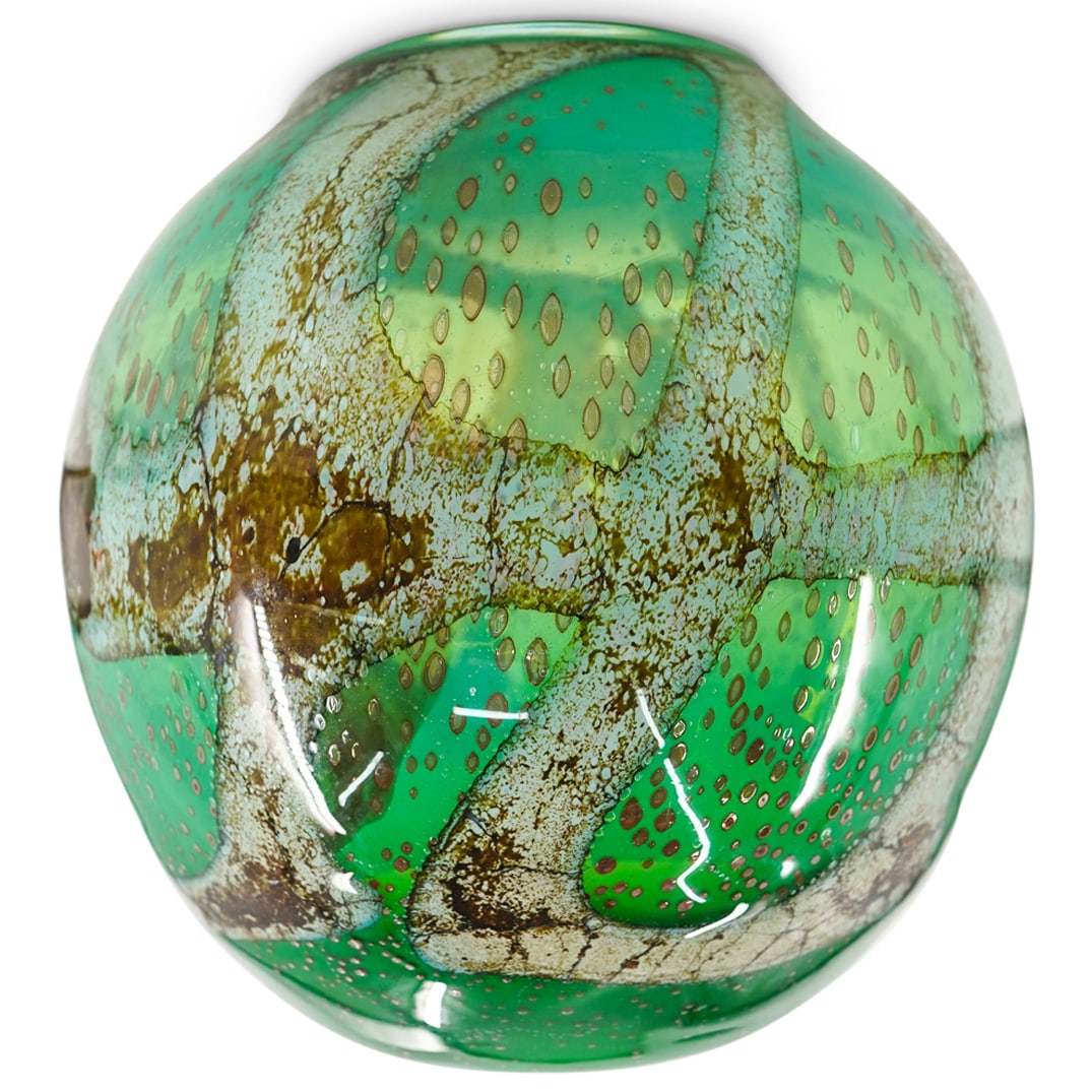 Murano Glass Goldstone Accented Bowl: DESCRIPTION: Murano glass bowl crafted in green accented with white and goldstone. Signed illegibly on underside. CIRCA: 20th Century ORIGIN: Italy DIMENSIONS: H: 9.25" D: 10" CONDITION: Minor wear co