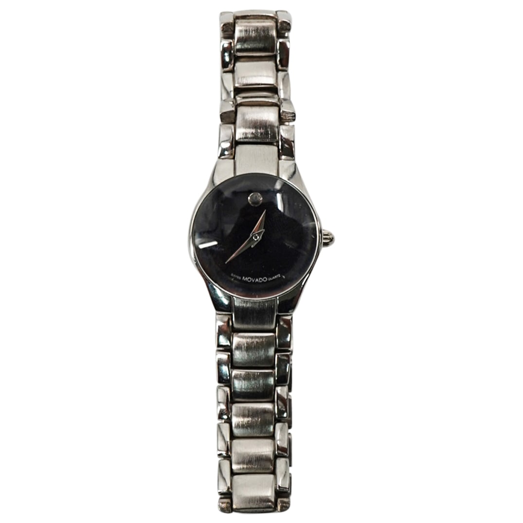 Movado All Stainless Black Quartz Ladies Watch: DESCRIPTION: Movado All Stainless Water Resistant Black Quartz Ladies Watch. T4A4028K. With original case CIRCA: 21 Century ORIGIN: Switzerland DIMENSIONS: W: 1" CONDITION: Good Pre-owned condition wi