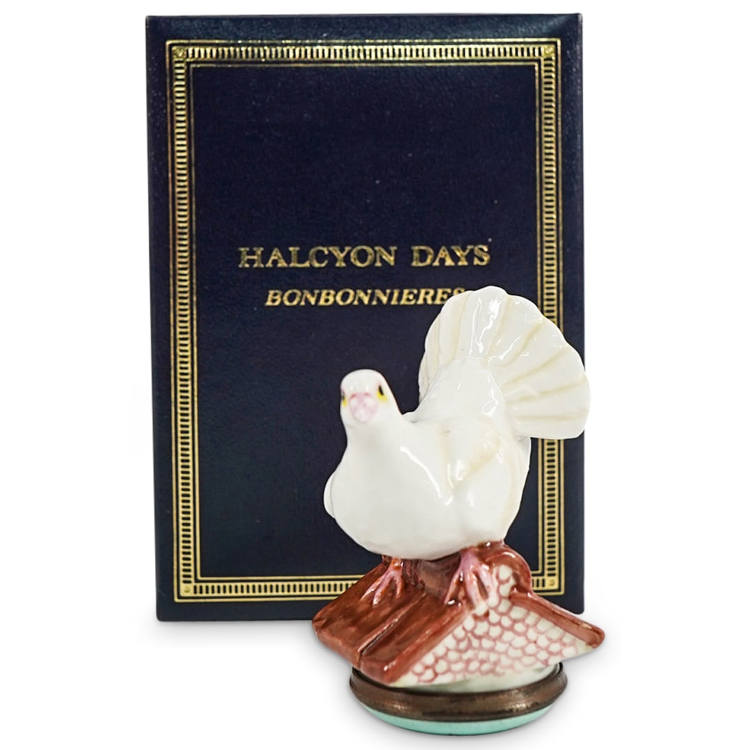 Halcyon Days "Fantail Dove" Enamel Bonbonniere Box: DESCRIPTION: A Halcyon Days "Fantail Dove" enamel pill bonbonniere box. Features a dove standing atop a house base. Opens to reveal a Halcyon Days London Logo. Includes original box with white satin l