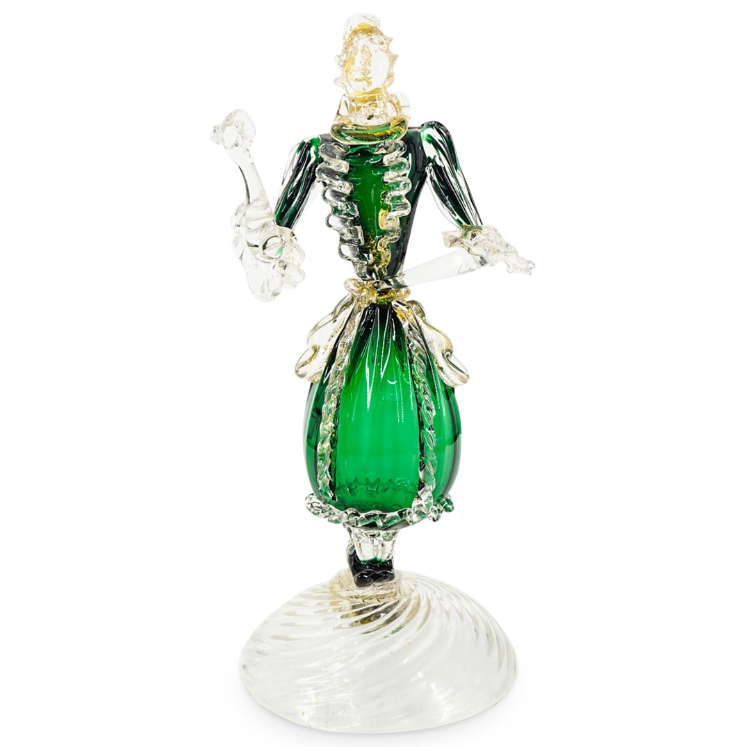 Venetian Glass Aventurina Figure: DESCRIPTION: Venetian glass figural sculpture depicting a lady holding a handkerchief and featuring gold fleck. CIRCA: Mid - Late 20th Century ORIGIN: Italian DIMENSIONS: H: 11.75" W: 5" L: 6" CONDITI