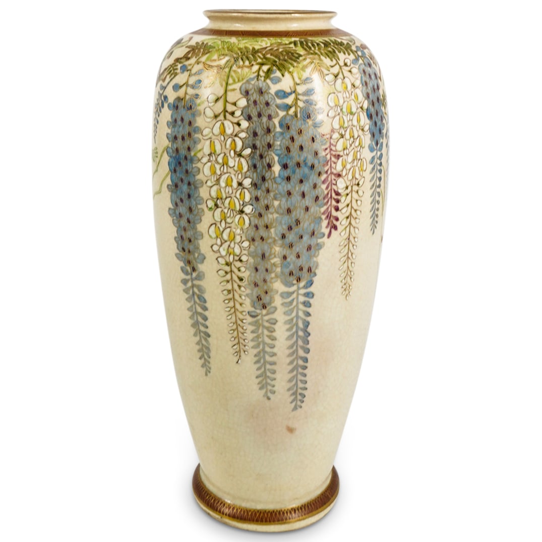 Antique Japanese Satsuma Vase: DESCRIPTION: Antique Japanese Meiji era (1868-1912) Satsuma vase with polychrome enameled wisteria decorations and gilt trims. Underside drilled through marking from previous conversion to table lamp.