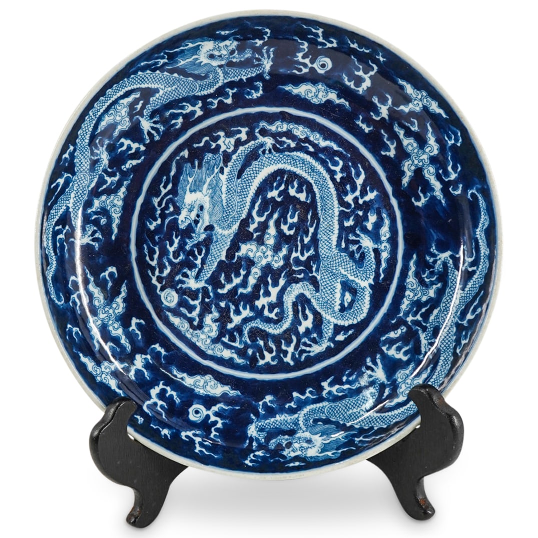 Antique Chinese Blue / White Porcelain Plate: DESCRIPTION: Antique Chinese blue and white porcelain plate embellished with painted dragon motifs. Marked with the underglaze blue six character Kangxi mark in a double circle, on the underside. CIRC