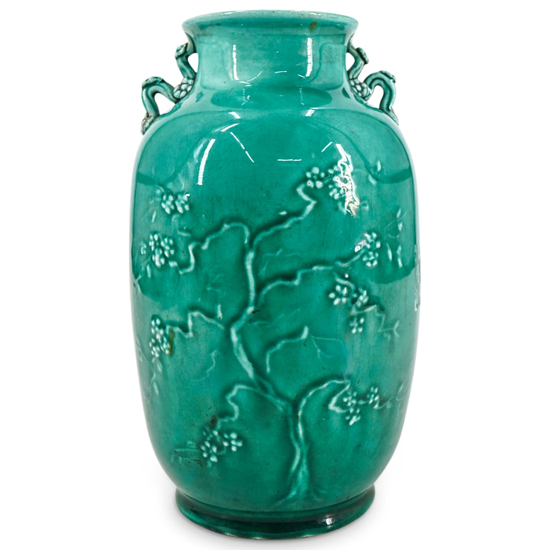 Antique Chinoiserie Porcelain Cherry Tree Vase: DESCRIPTION: Antique chinoiserie porcelain vase featuring raised cherry tree motif and light celadon glaze. Marked on underside. CIRCA: Late 19th - Early 20th Century ORIGIN: European DIMENSIONS: H: 8