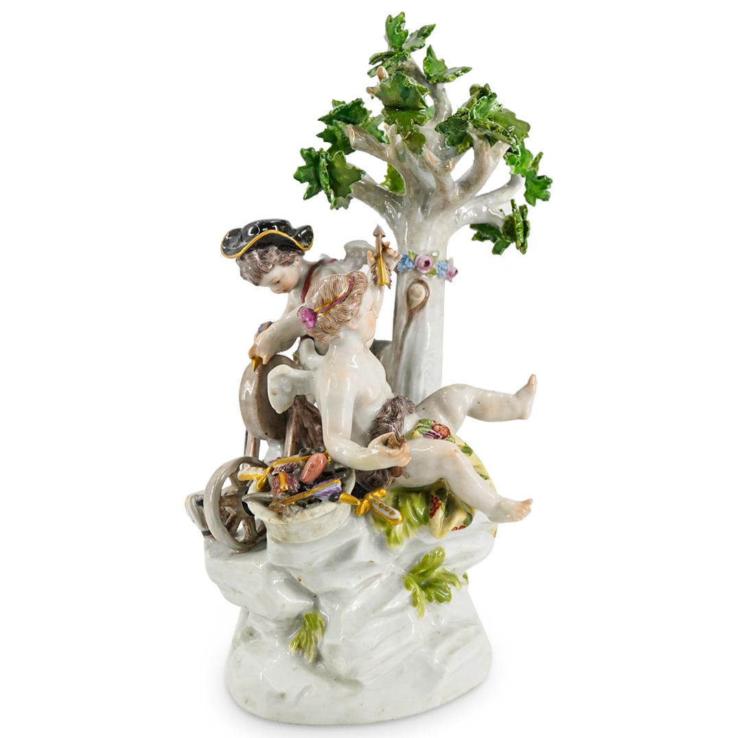 Antique Meissen Porcelain "Cupid Sharpening Arrows" Group Figurine: DESCRIPTION: Antique Meissen porcelain group figurine depicting a pair of semi nude putti cherub figures. One represents Cupid, sharpening his arrows, and the second figure depicts a winged female che
