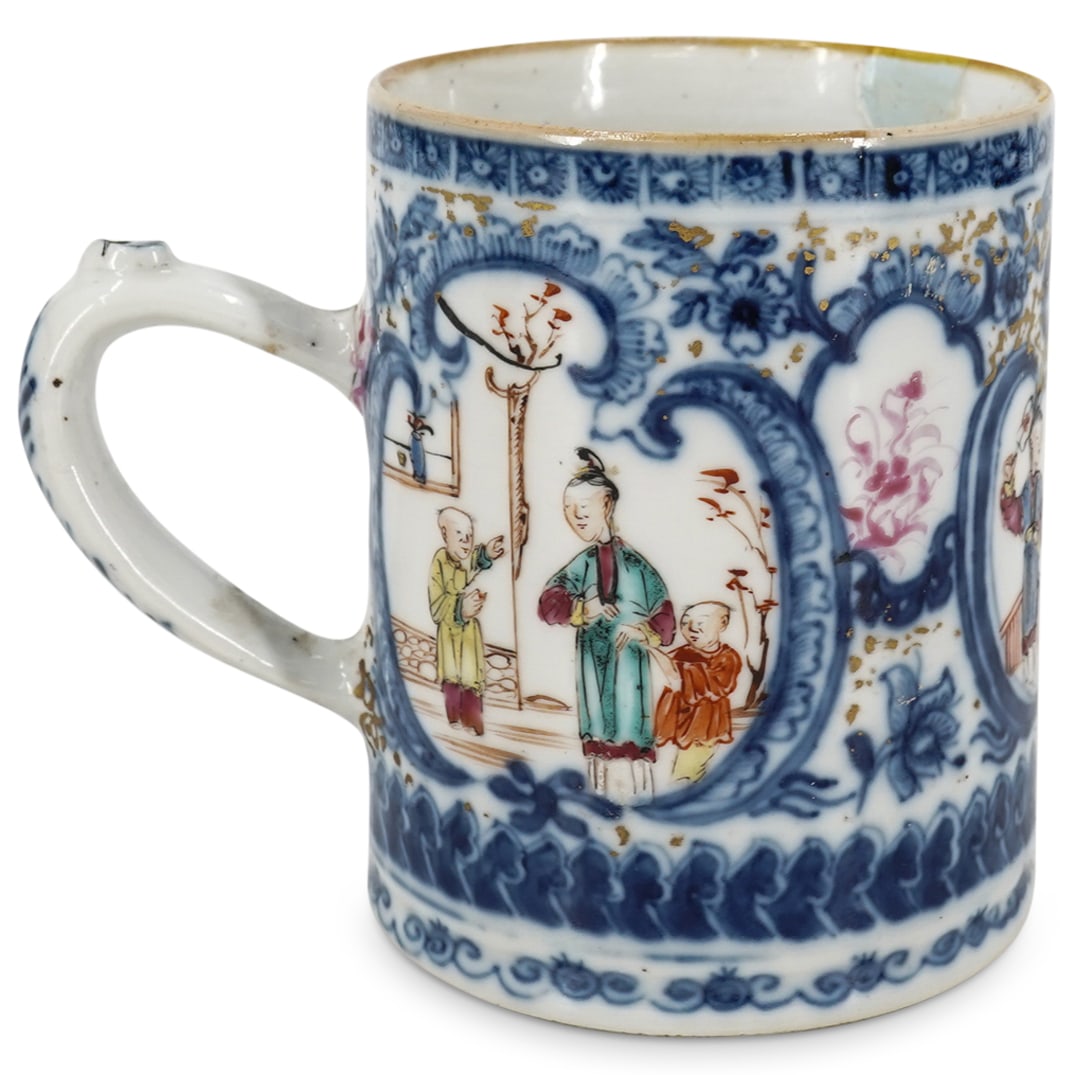 Antique Chinese Porcelain Famille Rose Cider Mug: DESCRIPTION: An antique Chinese porcelain cider mug with famille rose enameled courtyard scenes with and overall blue floral decoration throughout. CIRCA: 18th Cent. ORIGIN: China DIMENSIONS: H: 3.75"