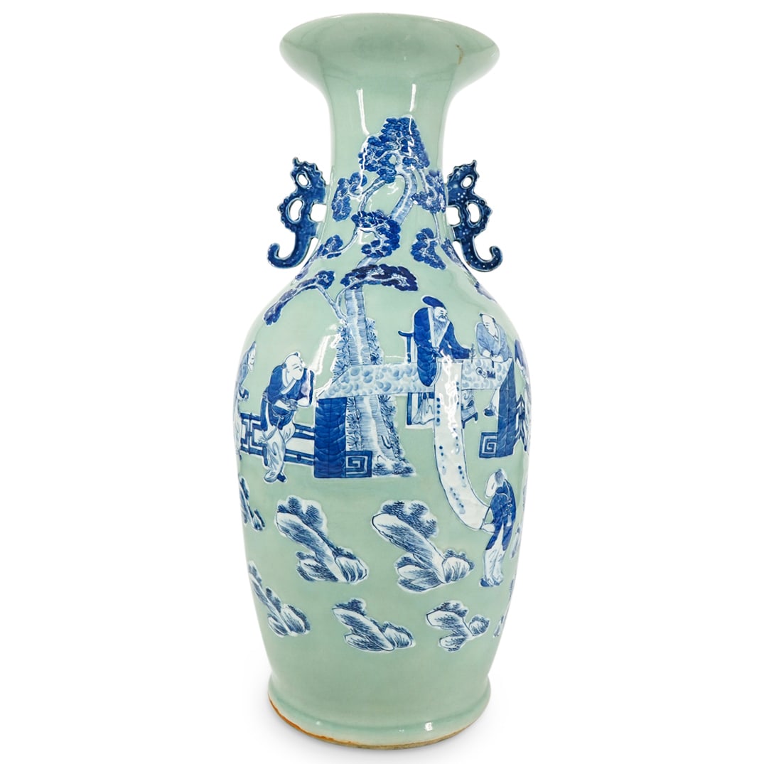 Antique Chinese Celadon Glaze And Blue And White Figure Porcelain Vase: DESCRIPTION: Antique porcelain vase coated in a celadon glaze and decorated with a scene of courtiers attending a scholar in a garden, all in blue and white. Fitted with dragon form handles beneath a