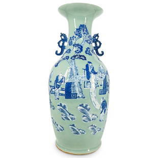 Antique Chinese Celadon Glaze And Blue And White Figure Porcelain Vase: DESCRIPTION: Antique porcelain vase coated in a celadon glaze and decorated with a scene of courtiers attending a scholar in a garden, all in blue and white. Fitted with dragon form handles beneath a