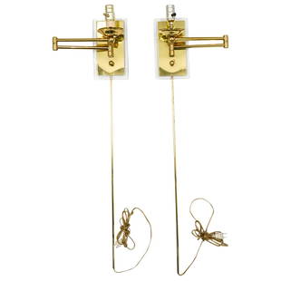 Pair of Karl Springer Attrib. Brass Wall Lamps: DESCRIPTION: A pair of Karl Springer attributed brass and lucite wall mounted lamps with extendable and adjustable swing arms. Each fitted with single light outlets and lucite backplates. CIRCA: 1980s