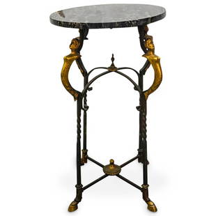 Portoro Marble & Wrought Iron Side Table: DESCRIPTION: Wrought iron side table or occasional table featuring Portoro marble top, partially twisted legs, hoof-form metal feet, and figural metal ornaments. CIRCA: 20th Century ORIGIN: Unknown DI