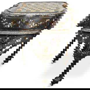 Antique MOP Inlaid Chess Table: DESCRIPTION: Antique wooden chess table featuring mother of pearl inlay, floral motifs, gilt foliage motifs, gilt accents, a single drawer, three legs, and three casters with porcelain wheels. CIRCA: