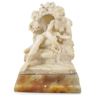 Art Nouveau Italian Alabaster Figural Table Lamp, Signed Pozzi: DESCRIPTION: Art Nouveau table lamp carved from alabaster in the form of a nude woman seated among flower laden stones, the enclave behind her housing the lamp proper. CIRCA: Early 20th Century ORIGIN