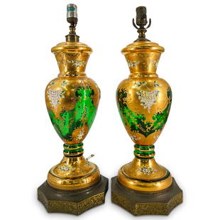 Pair Of Bohemian Glass Enameled Flower Table Lamps: DESCRIPTION: Two matching single socket table lamps, each crafted from a green glass vase accented throughout with enameled floral designs against gilt backgrounds bordered by gilt foliage and surroun