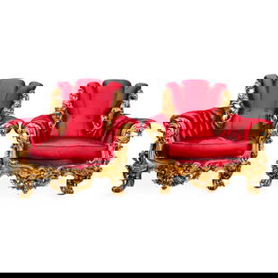 Pair Carved Giltwood Upholstered Arm Chairs: DESCRIPTION: A pair of armchairs crafted with a carved gilt wood foundation displaying ornate motifs with lion and bird decorations. Completed with a burgundy red upholstery. CIRCA: 20th Cent. ORIGIN:
