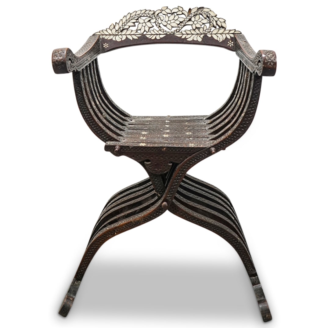 19th C. Syrian Mother Of Pearl Inset Savonarola Chair: DESCRIPTION: Antique carved wood chair crafted in a Savonarola or "X" design and decorated on its top rail with mother-of-pearl insets patterned as flowers and foliage. CIRCA: 19th Century ORIGIN: Syr