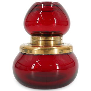 Large Art Deco Glass Paperweight Inkwell: DESCRIPTION: A large Art Deco inkwell comprised of a ruby red glass body and finial with a brass hinged collar. CIRCA: Early 20th Cent. ORIGIN: USA DIMENSIONS: H: 5.5' W: 4' CONDITION: Great