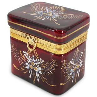 Antique Bohemian Ruby Glass and Enamel Hinged Casket Box: DESCRIPTION: An antique Bohemian glass box features in a ruby glass foundation decorated with enamel painted flowers and gilt accents, decorated with a gilt metal collar at the closure. CIRCA: Late 19