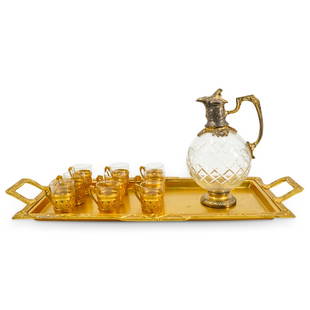 (11 Pc) 19th Century French Christofle Gilt Cruet And Shot Glass Set: DESCRIPTION: Antique cruet and shot glass set featuring nine shot glasses, one cruet, and one tray. Glasses are each mounted in a metal holder adorned with a handle and cruet's cut glass body is fitte