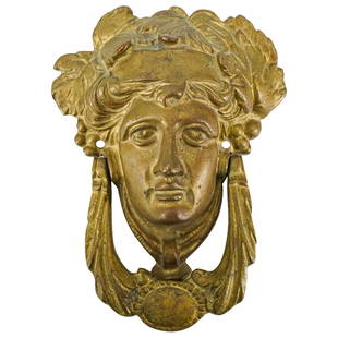 Vintage Neoclassical Cast Brass Athena Mask Door Knocker: DESCRIPTION: Vintage Neoclassical Cast Brass Athena Mask Door Knocker. This vintage door knocker is cast with the mask of Athena, the Greek goddess of wisdom and war. CIRCA: 20th Century ORIGIN: DIMEN