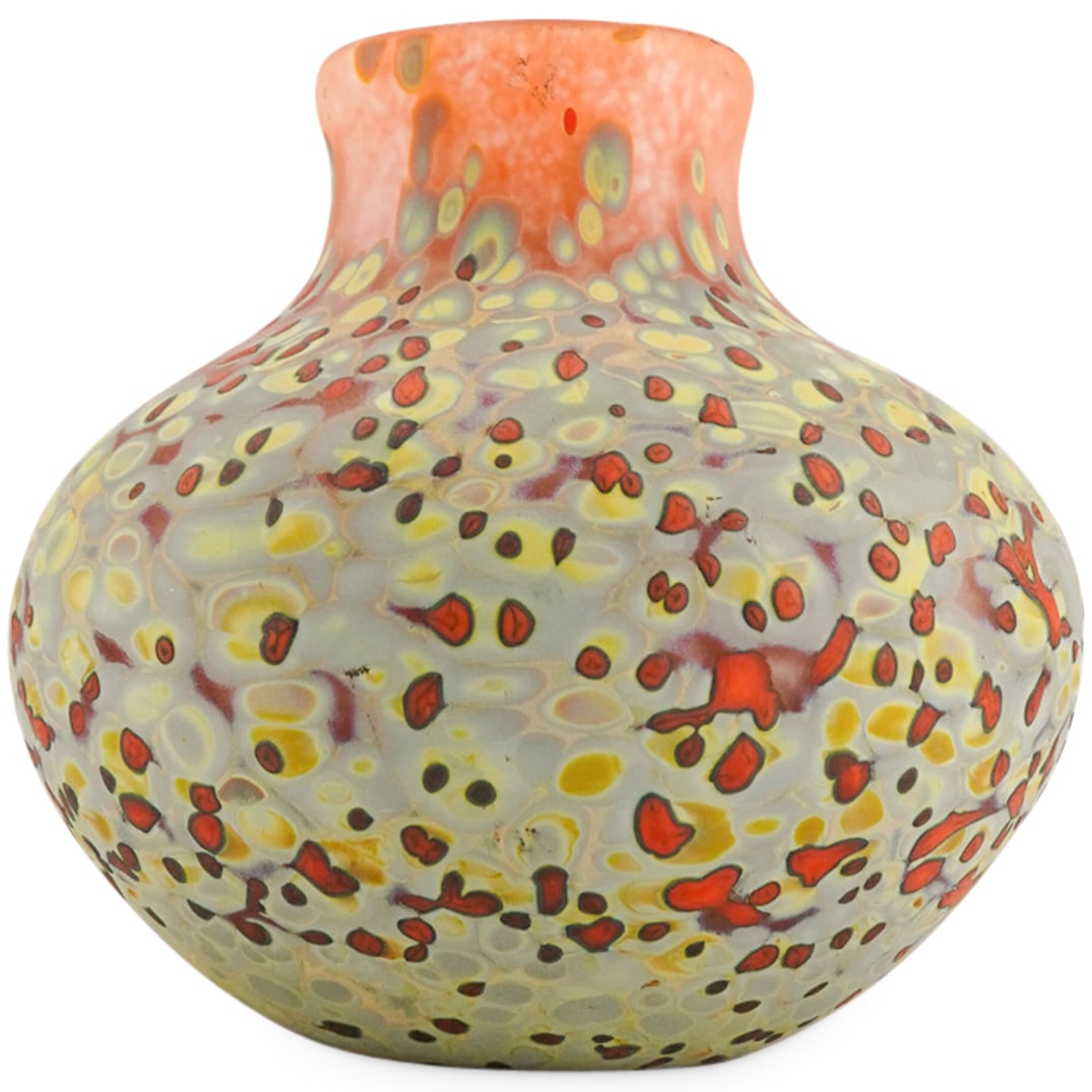 Signed Orange Spatter Glass Amphora Vase: DESCRIPTION: Signed orange splatter art glass amphora-shaped vase. In orange color with yellow hued dots. Signed on the underside. CIRCA: 20th Century ORIGIN: DIMENSIONS: H: 5 1/2" W: 5" CONDITION: Go