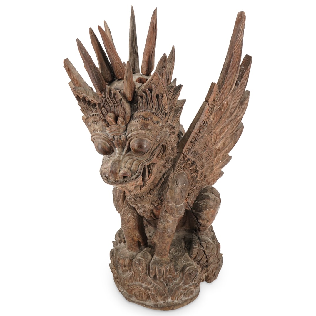 Antique Balinese Carved Wood Singha Winged Lion Architectural Base: DESCRIPTION: Carved wood sculpture depicting a singha, a Balinese winged lion, spreading his wings and looking down with a fierce, bulging-eyed gaze. Enclave on singha's back suggests piece formed the