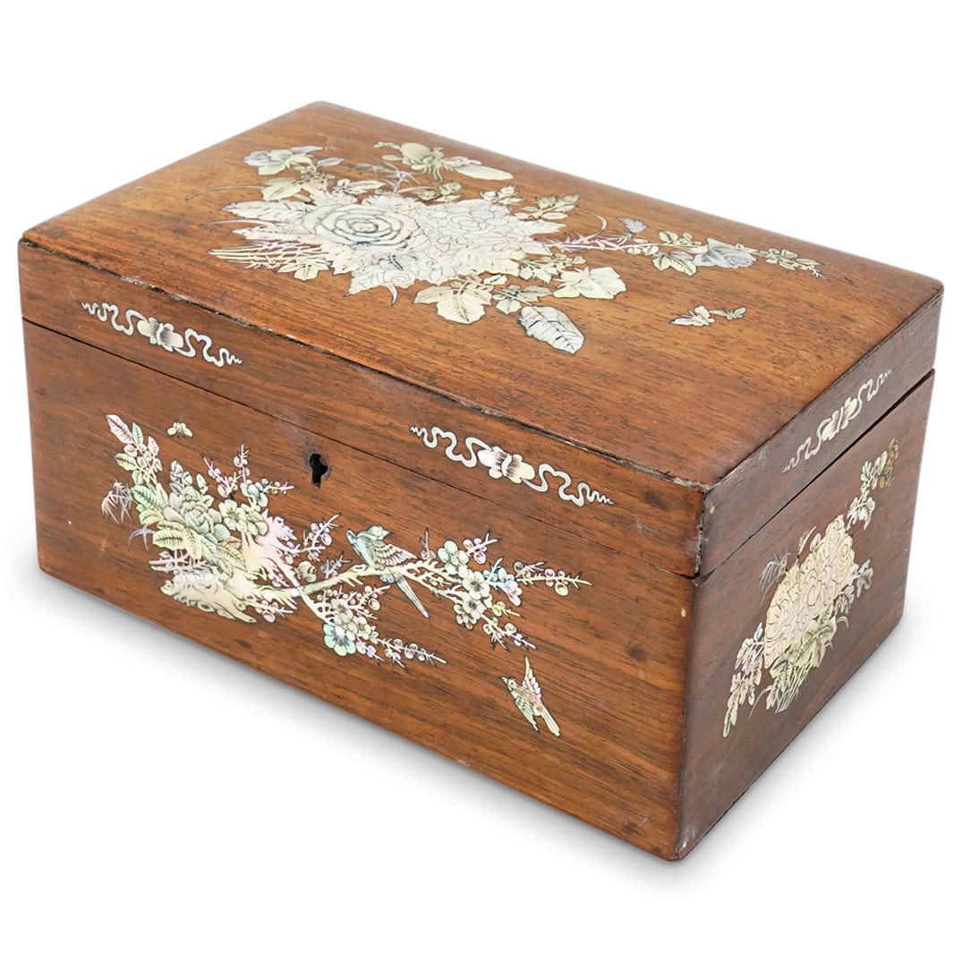 Antique Chinese Carved Wood And Mother Of Pearl Box: DESCRIPTION: Antique carved wood box featuring ornately detailed mother-of-pearl insets depicting butterflies and birds perched on and flying around flowers and foliage. Finished with Han character in