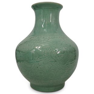 Antique Chinese Finely Carved Celadon Glazed Vase: DESCRIPTION: A large carved vase supported on a short slightly spreading foot, decorated with a classic wide band of lotus flowers and scrolling foliage between a band of lappets above the foot and