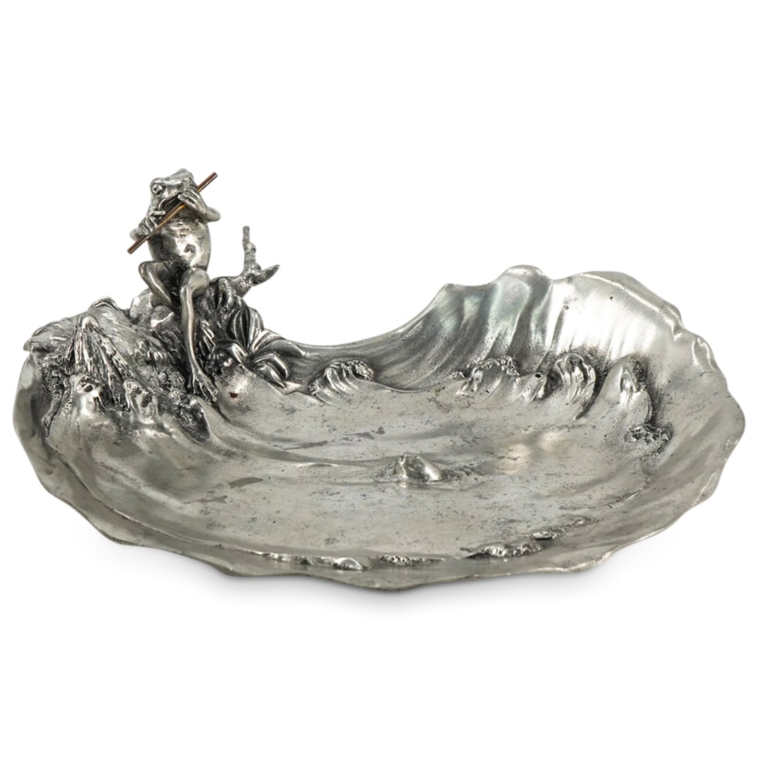 Achille Gamba Art Nouveau Pewter Frog Dish: DESCRIPTION: Achille Gamba art nouveau pewter dish depicting a frog playing a flute while seated before a body of water with waves, a fish sticking its head out to listen. Marked on underside with "GS