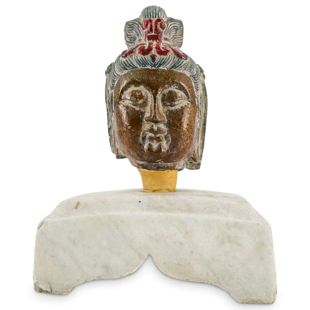 Antique Chinese Polychrome Guan Yin Head On Marble: DESCRIPTION: Antique carved stone sculpture depicting a polychrome Guan Yin head featuring featuring gilt skin and mounted on a four footed, carved marble base. Provenance: Estate Of David Schofield, 