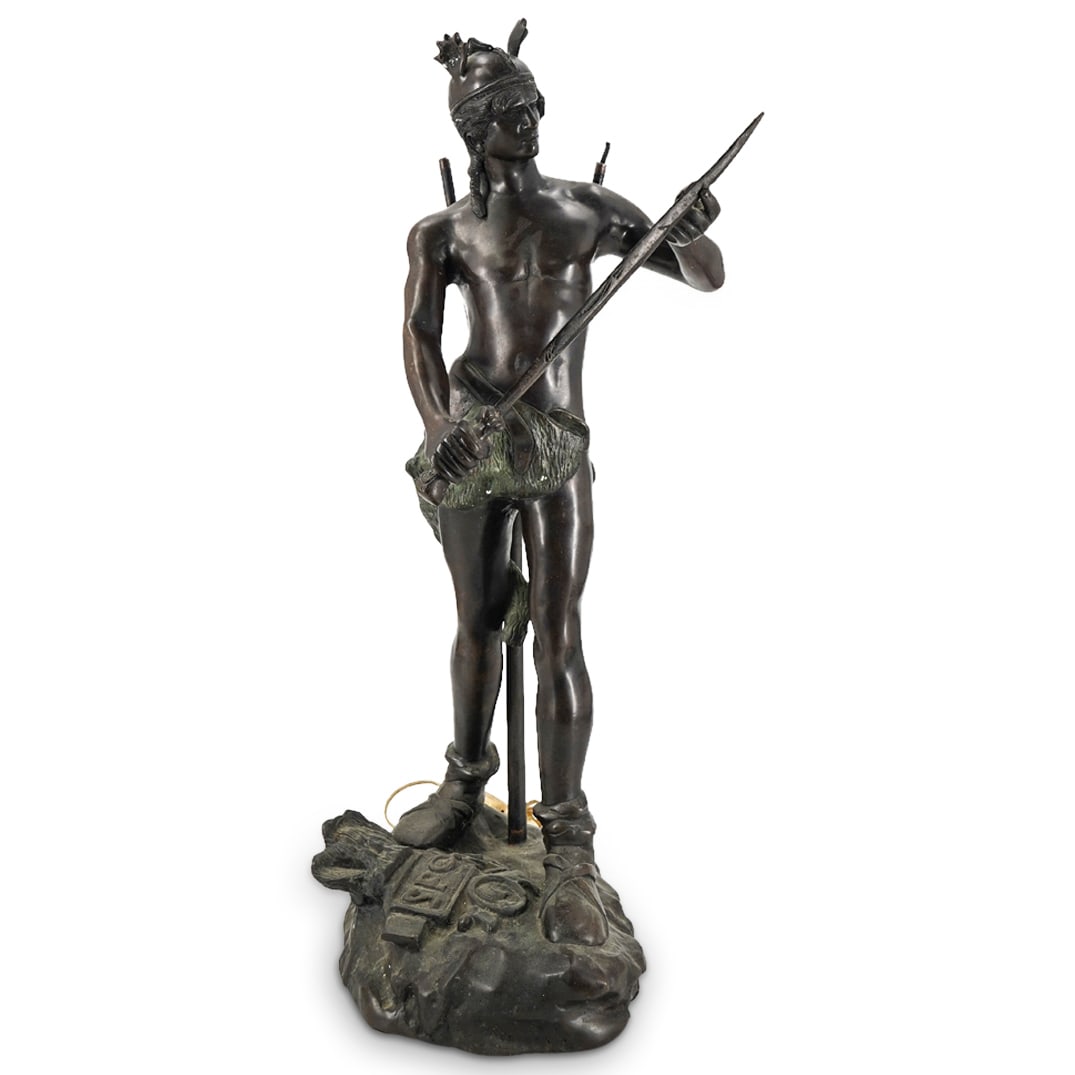 After Andre Massoulle "Sword Of Valor" Bronze Sculpture: DESCRIPTION: Bronze sculpture after Andre Massoulle's "Sword of Valor" depicting a barbarian inspecting a sword as he stands atop a Roman standard and featuring fittings for use as a lamp. CIRCA: 20th
