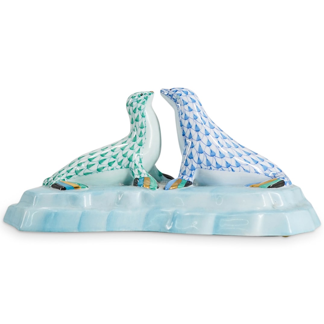 Herend Porcelain "Kissing Sea Lions" Fishnet Figurine: DESCRIPTION: Herend porcelain figurine depicting "Kissing Sea Lions" and featuring green and blue fishnet pattern and gilded accents. Style number: #15911. Marked with Herend hallmark on the underside