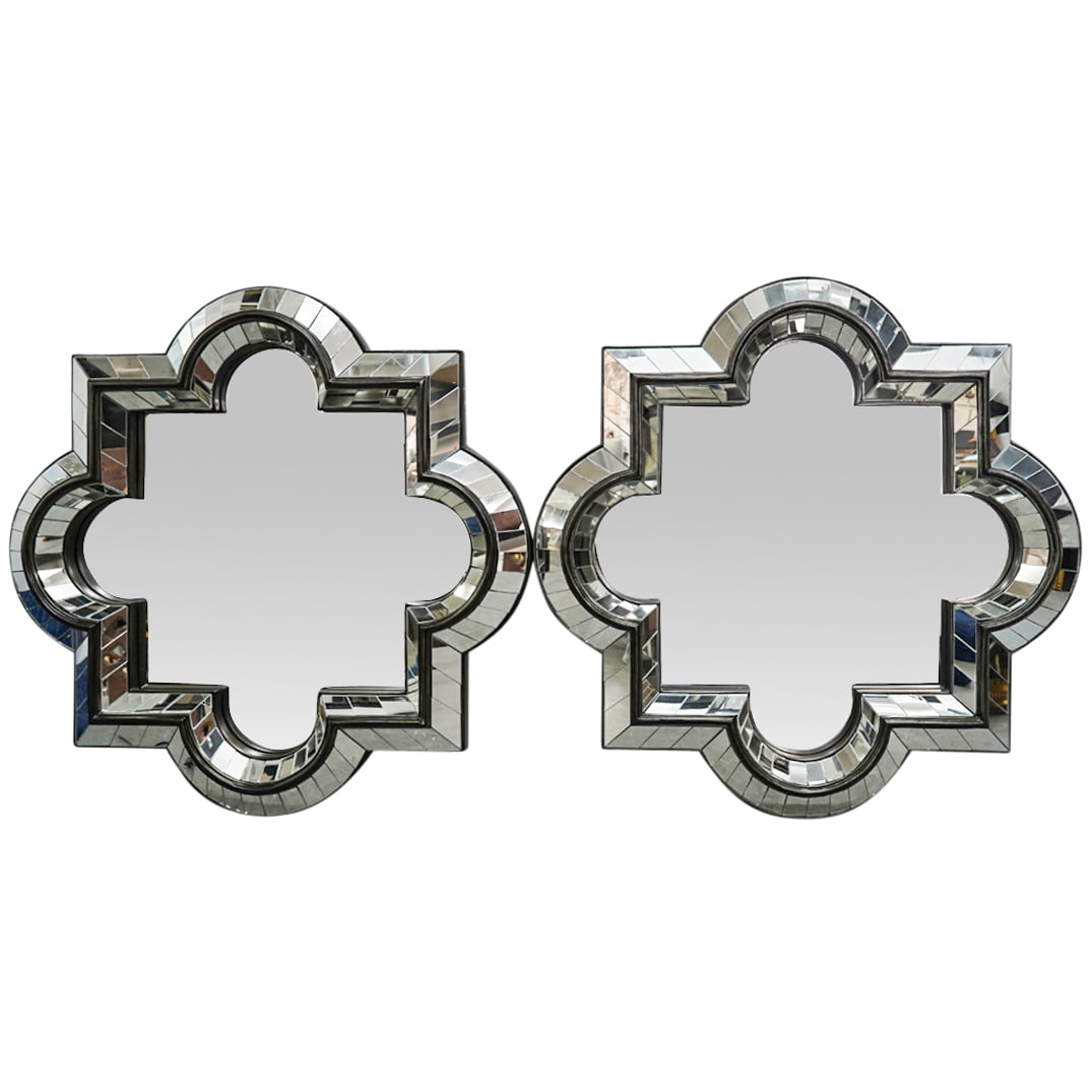 Pair Of Mirror-Framed Mirrors: DESCRIPTION: Each of quatrefoil shape, with an inner and outer border of mirrored glass panels. Labels adhered to reverse. CIRCA: Early 21st Century ORIGIN: China DIMENSIONS: H: 36" W: 36" CONDITION: 